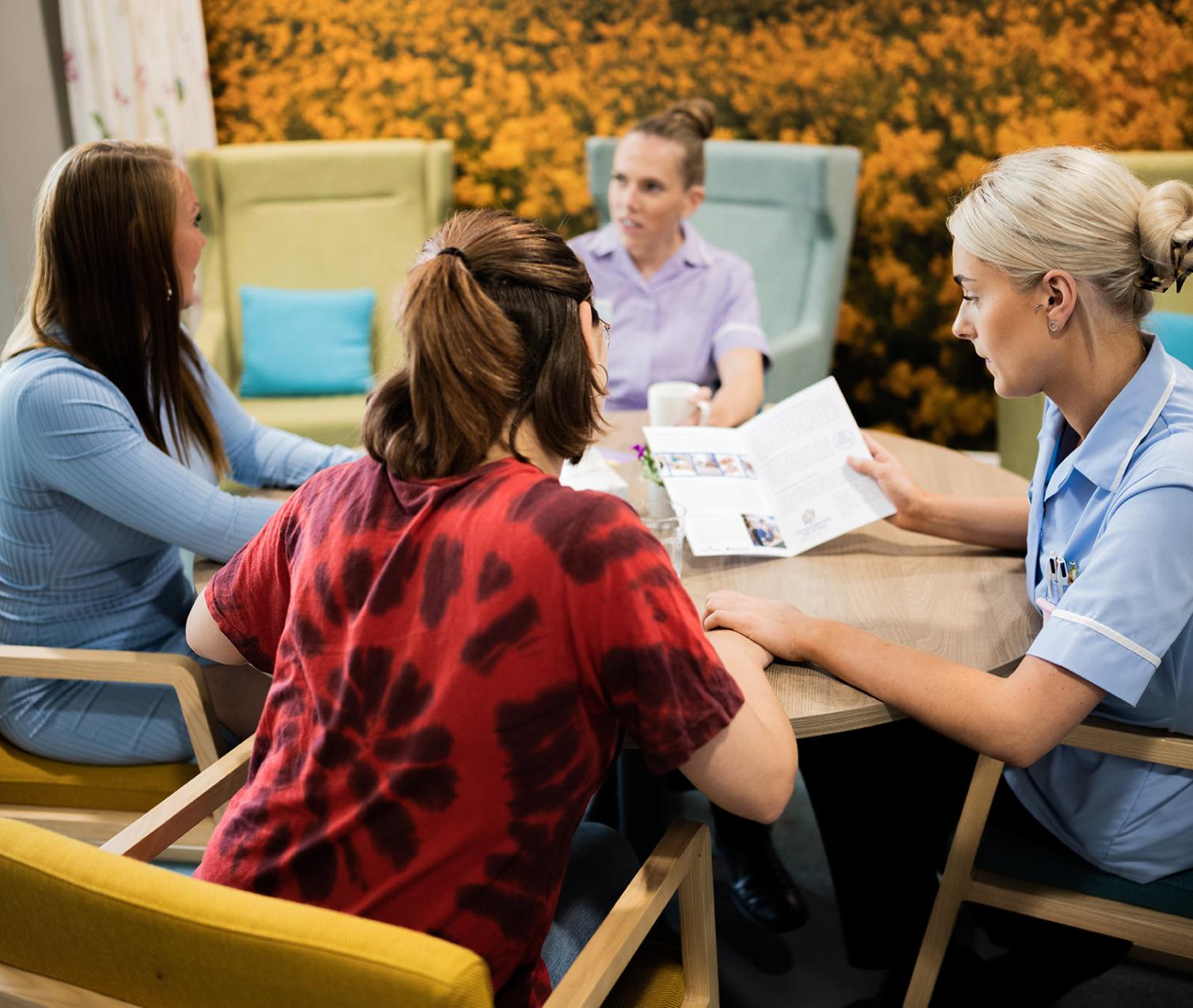 Patient family members talk with Hospice staff members